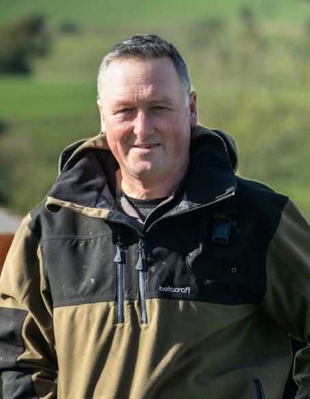 Sector Chair Colin Bateman in field of cows